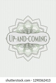 Green linear rosette with text Up-and-coming inside