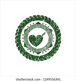 Green love icon inside distressed rubber seal