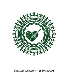 Green love icon inside distressed rubber grunge seal