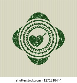 Green love icon inside rubber seal with grunge texture