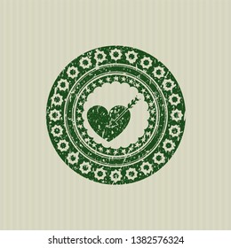 Green love icon inside rubber seal with grunge texture