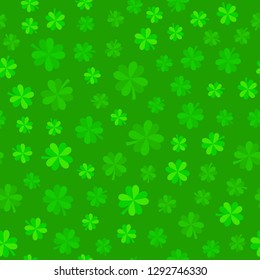 Green lucky clover leaves background. Seamless vector pattern. Green foliage jungle pattern. Four-leaf shamrock background for St Patrick Day.