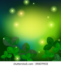 Green magic background with lights and leaves of clover.