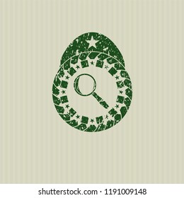 Green magnifying glass icon inside distress grunge style stamp