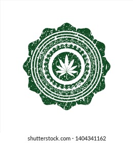 Green marijuana leaf icon inside distressed rubber grunge texture seal