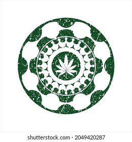 Icono verde de la hoja de marihuana dentro del estampado de hule angustiado. 