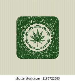 Green marijuana leaf, weed icon inside distressed rubber stamp