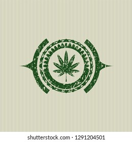 Green marijuana leaf, weed icon inside distressed rubber seal