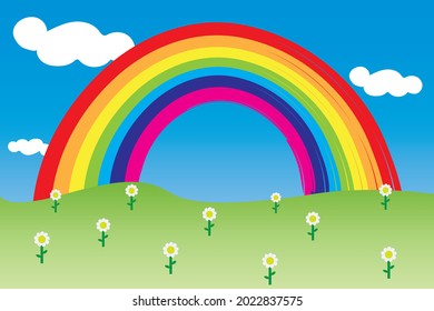 Green meadow with daisies and the rainbow in the background 