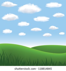 green meadow, hill, blue sky and clouds in summertime