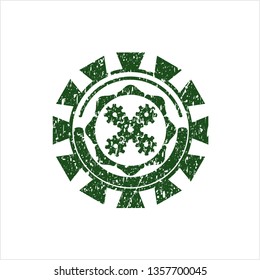 Green mechanism icon inside distressed with rubber seal texture