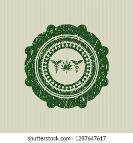 Green medicinal weed icon inside distressed rubber grunge stamp