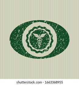 Green medicine icon inside rubber grunge seal