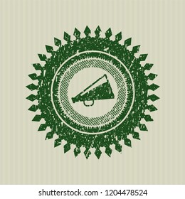 Green megaphone icon inside rubber grunge texture seal