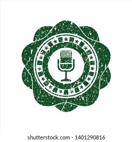 Green microphone icon inside distress rubber grunge texture stamp