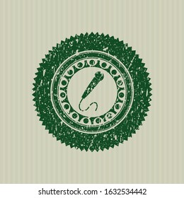 Green microphone icon inside distressed with rubber seal texture