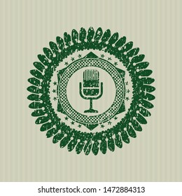 Green microphone icon inside grunge style stamp