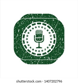 Green microphone icon inside rubber texture
