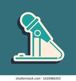 Green Microphone icon isolated on blue background. On air radio mic microphone. Speaker sign. Long shadow style. Vector Illustration