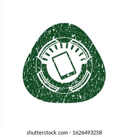 Green mobile phone icon inside distressed rubber seal