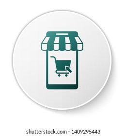 Green Mobile phone and shopping cart with striped awning icon isolated on white background. Online buying symbol. Supermarket basket symbol. White circle button. Vector Illustration