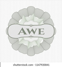 Green money style emblem or rosette with text Awe inside
