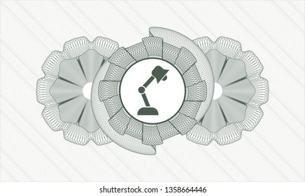 Green money style emblem or rosette with desk lamp icon inside