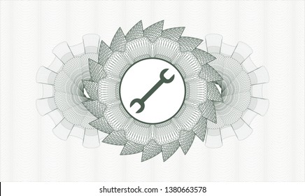 Green money style emblem or rosette with wrench icon inside