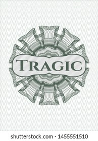 Green money style emblem or rosette with text Tragic inside