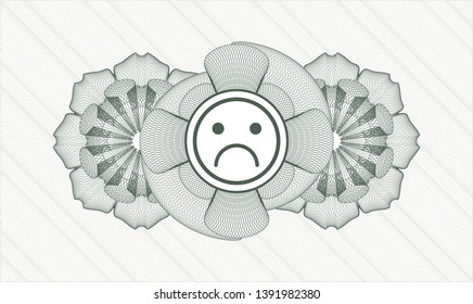 Green money style rosette with sad face icon inside