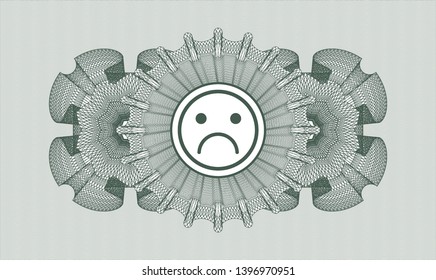 Green money style rosette with sad face icon inside