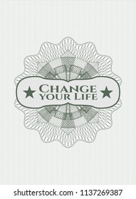 Green money style rosette with text Change your Life inside