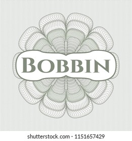 Green money style rosette with text Bobbin inside
