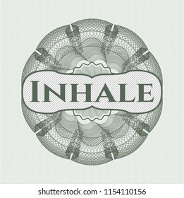 Green money style rosette with text Inhale inside