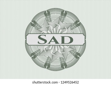 Green money style rosette with text Sad inside