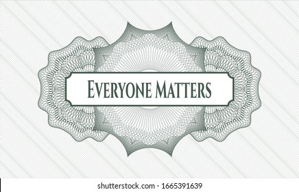 Green money style rosette with text Everyone Matters inside