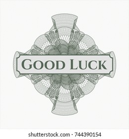 Green money style rosette with text Good Luck inside