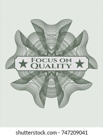 Green money style rosette with text Focus on Quality inside