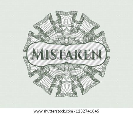 Green money style rosette with text Mistaken inside