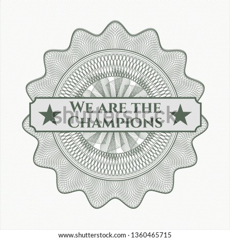 Green money style rosette with text We are the Champions inside