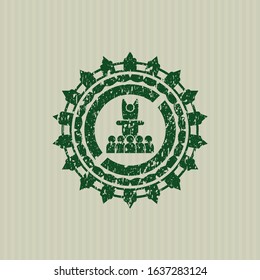 Green motivational speech icon inside distress rubber stamp with grunge texture