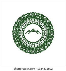 Green mountain icon inside distressed rubber grunge texture seal