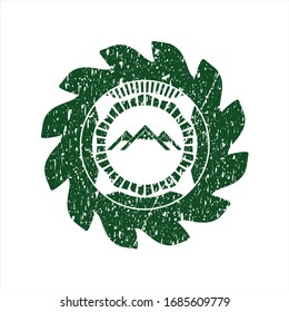 Green mountain icon inside distressed rubber grunge stamp