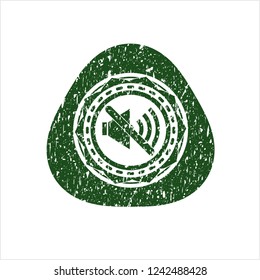Green mute icon inside distressed rubber stamp with grunge texture