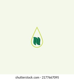 Green Natural organic leaf and droplet of water logo symbol in isolated background