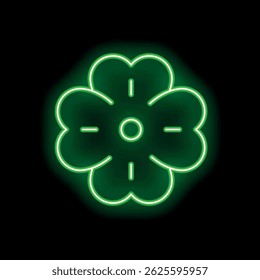 Green neon sign shaped like a four leaf clover glowing on black background