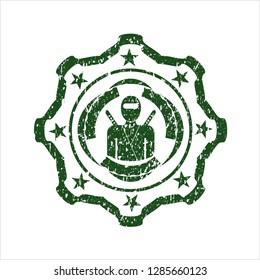 Green ninja icon inside distress rubber grunge texture seal