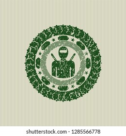 Green ninja icon inside distressed rubber texture