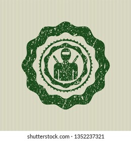 Green ninja icon inside rubber stamp