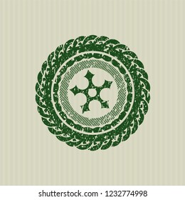 Green ninja star icon inside distressed rubber grunge texture seal